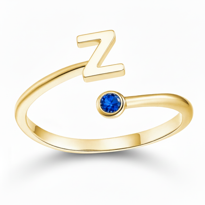 Anello regolabile con iniziale "Essence"